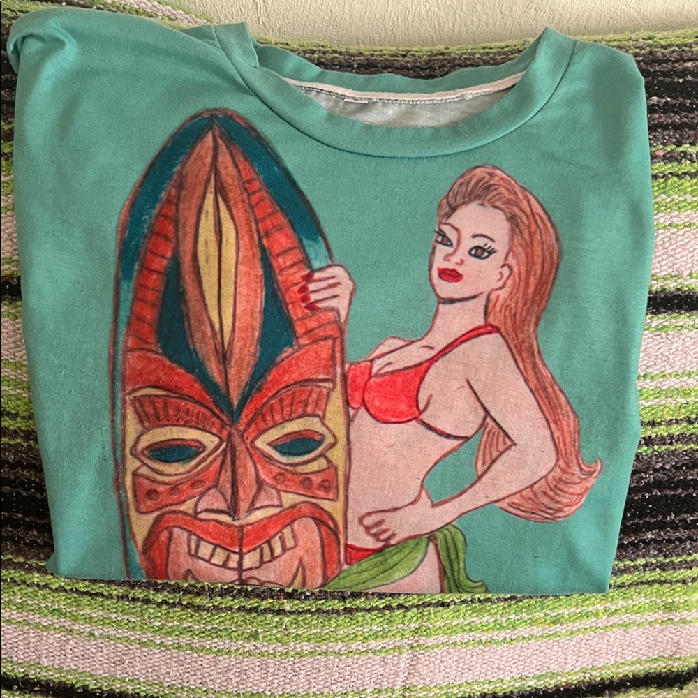 (S) Tiki woman Graphic T’shirt with Surfboard Designed by Julie Lee Nersinger - Picture 7 of 11